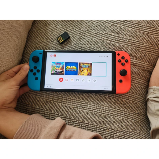 تصویر  کنسول بازی هیبریدی نینتندو مدل Switch - OLED Neon Blue and Neon Red ظرفیت 64 گیگابایت